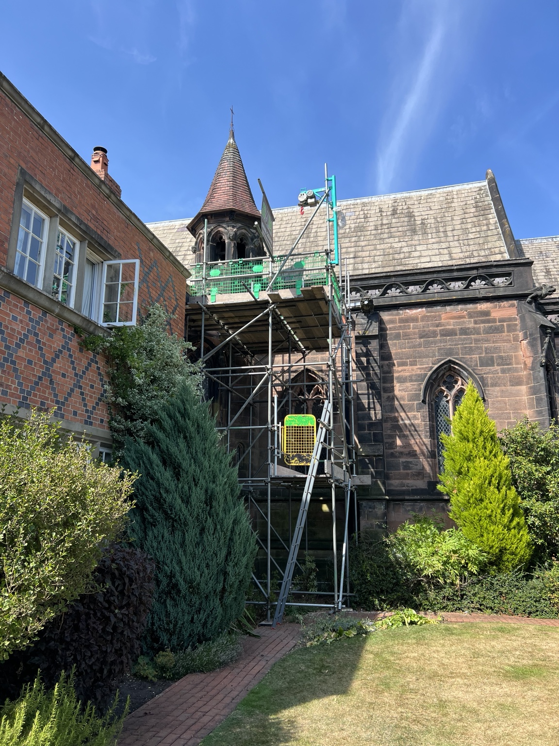 SAM Scaffolding access beside the carved stonework and roof of a building on the Arley Hall estate